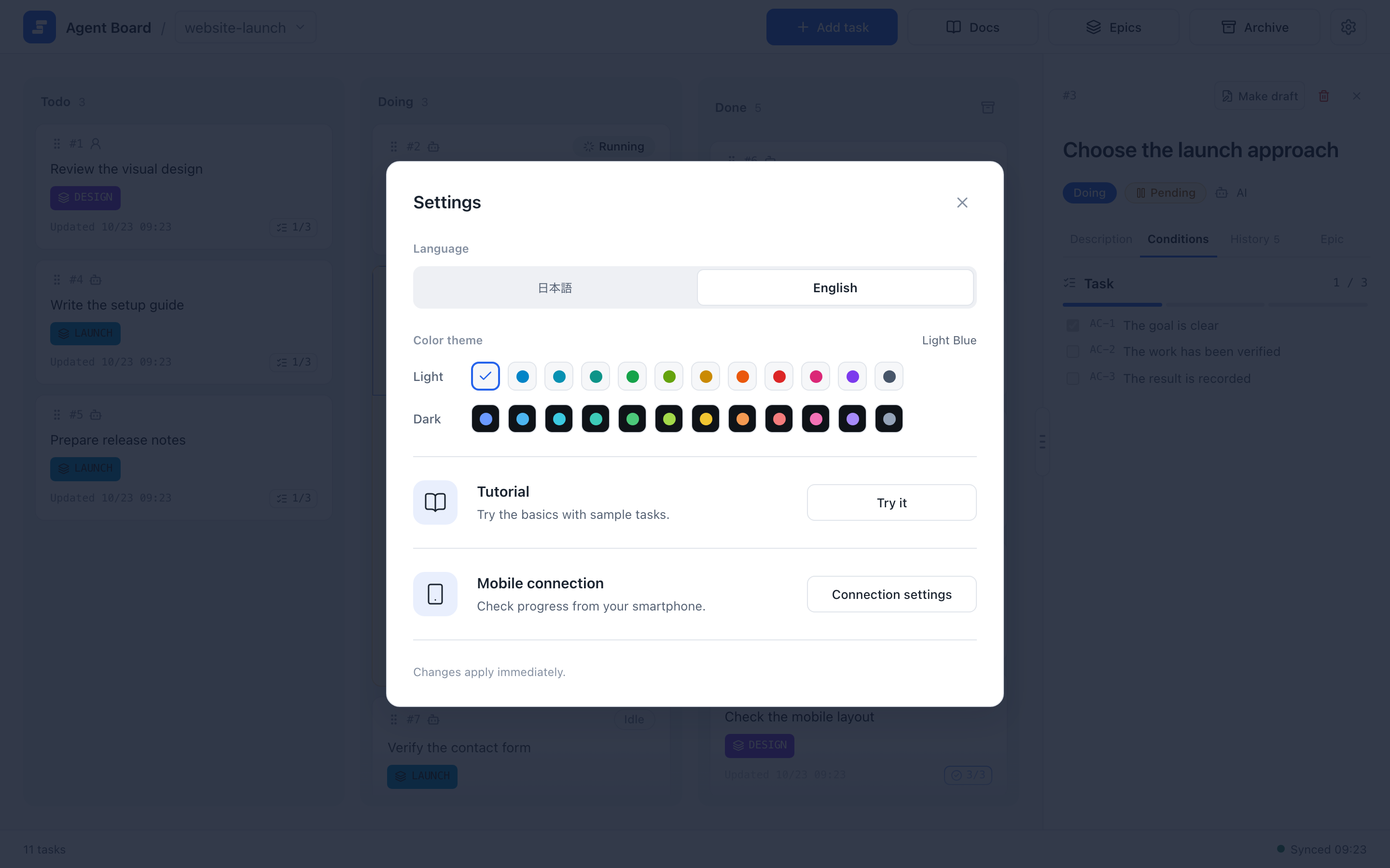 Settings dialog with the language switch, the light and dark color theme choices, and the Tutorial and Mobile connection rows